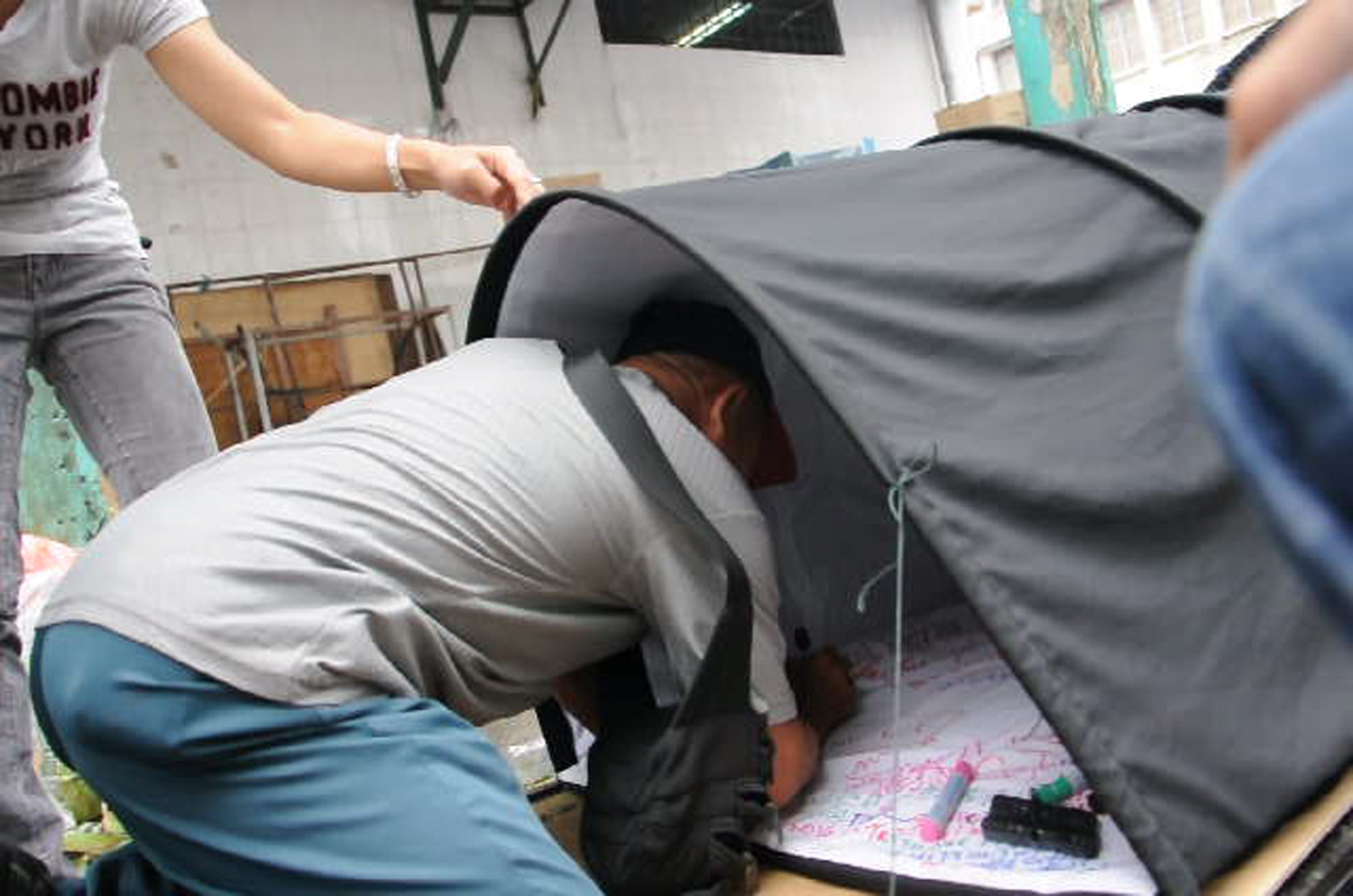 A participant making remarks in Shelter 1.0.
